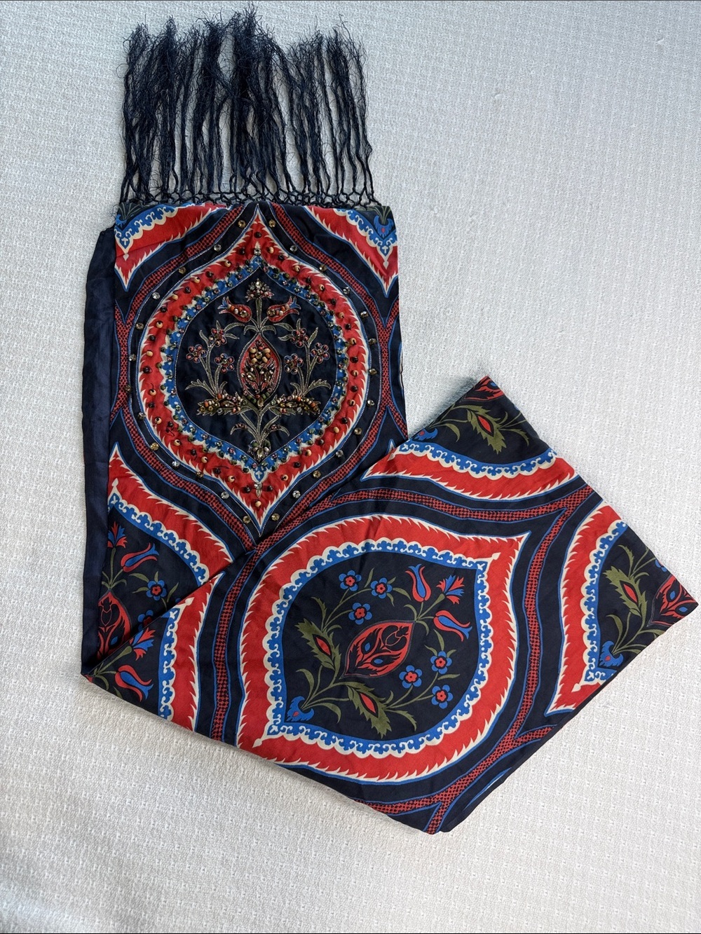 Navy bkue and red print scarf with fringe, beading, and jewel embellishments